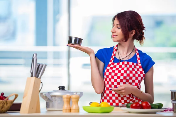 Young cook working in the kitchen — Stock Photo, Image