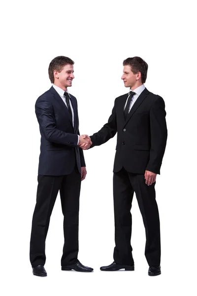 Dois irmãos gêmeos handshaking isolado no branco — Fotografia de Stock