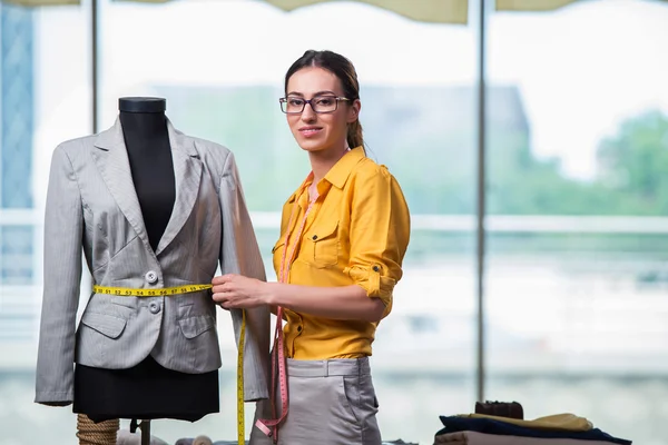 Woman tailor working on new clothing — Stock Photo, Image