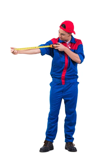 Young repairman with tape measure isolated on white — Stock Photo, Image