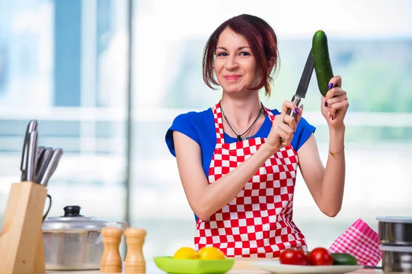 Young cook working in the kitchen