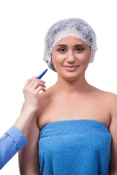 Mujer joven que se prepara para la cirugía plástica aislada en blanco —  Fotos de Stock