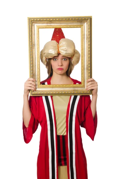 Mujer mago en ropa roja aislado en blanco — Foto de Stock