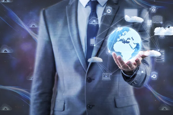 Businessman holding earth in global concept — Stock Photo, Image