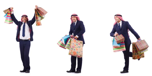 Arab muž s nákupními dárky na bílém — Stock fotografie
