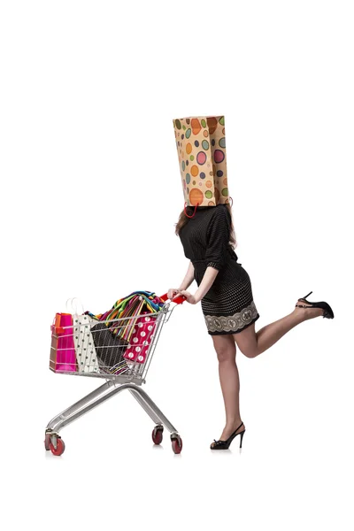 Mulher com carrinho de compras e sacos isolados em branco — Fotografia de Stock