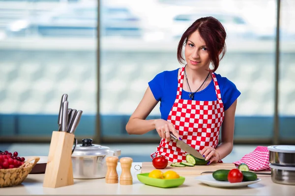 Young cook working in the kitchen — Stock Photo, Image