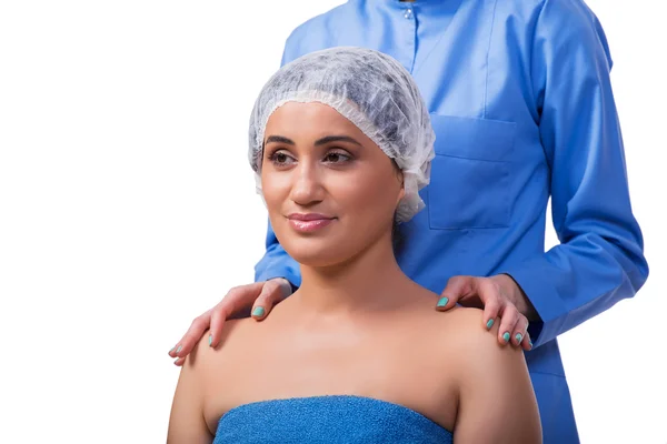 Mujer joven que se prepara para la cirugía plástica aislada en blanco —  Fotos de Stock