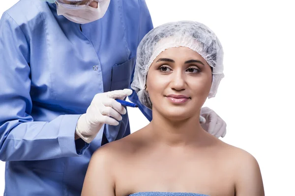 Jonge vrouw voorbereiden op plastische chirurgie geïsoleerd op wit — Stockfoto