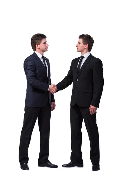 Dois irmãos gêmeos handshaking isolado no branco — Fotografia de Stock