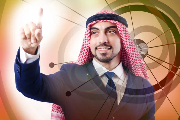 Arabiska mannen att trycka på virtuella knappar i futuristiska koncept — Stockfoto