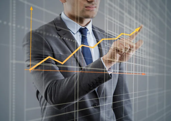 Jonge zakenman met grafiek diagrammen — Stockfoto