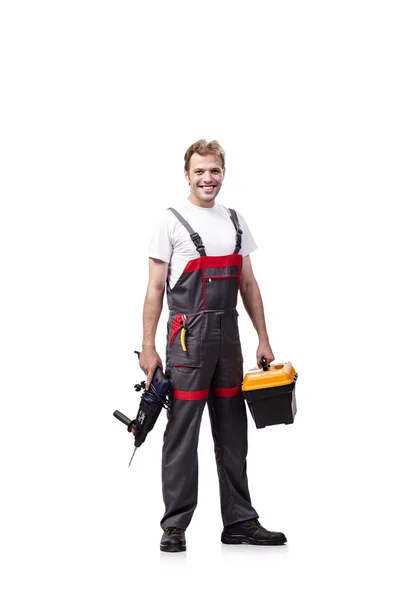 Jonge reparateur met boor perforator geïsoleerd op wit — Stockfoto