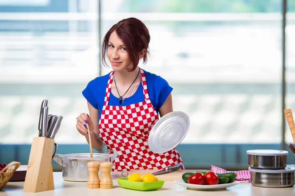 Young cook working in the kitchen — Stock Photo, Image