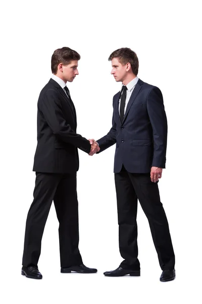 Dois irmãos gêmeos handshaking isolado no branco — Fotografia de Stock