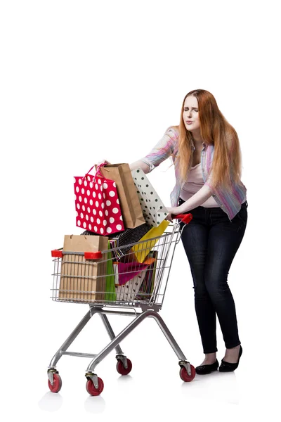 Woman with shopping cart and bags isolated on white — Stock Photo, Image