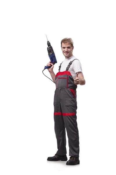 Jonge reparateur met boor perforator geïsoleerd op wit — Stockfoto