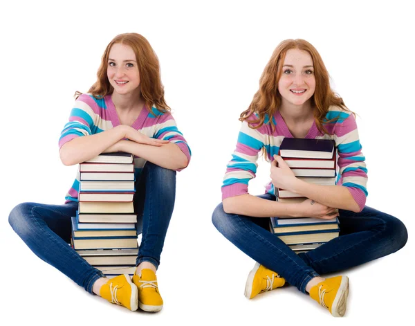 Joven estudiante con libros aislados en blanco — Foto de Stock