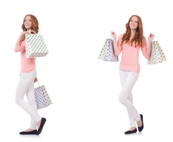 Jovem com sacos de compras isolados em branco — Fotografia de Stock