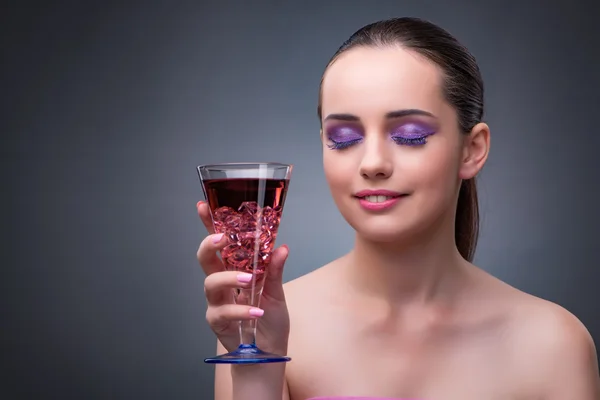 Nice woman drinking red cocktail — Stock Photo, Image