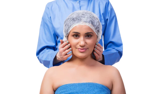 Fiatal nő felkészülés elszigetelt fehér plasztikai sebészet — Stock Fotó