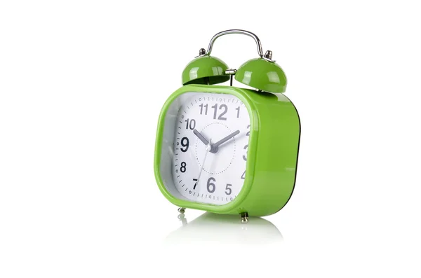Reloj despertador en el tiempo concepto aislado en blanco — Foto de Stock