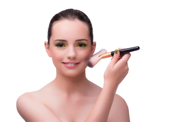 Mujer joven durante la sesión de maquillaje aislado en blanco — Foto de Stock