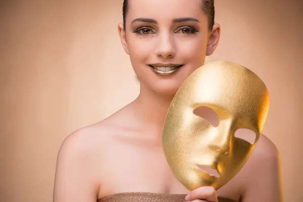 Mujer joven con máscara en concepto de carnaval —  Fotos de Stock