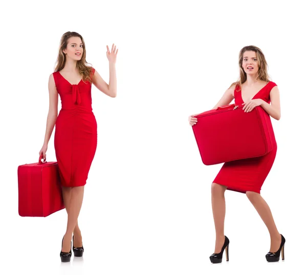 Jeune femme en robe rouge avec valise isolée sur blanc — Photo