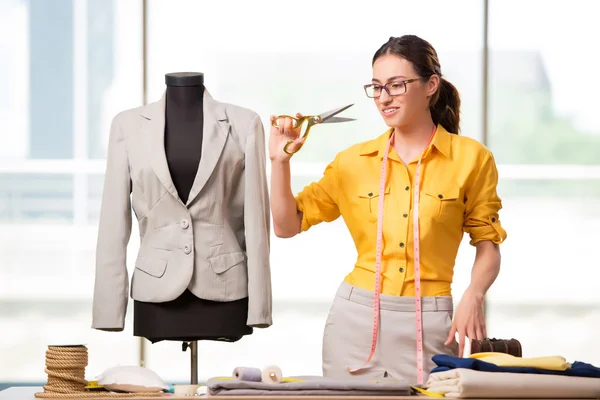 Woman tailor working on new clothing — Stock Photo, Image