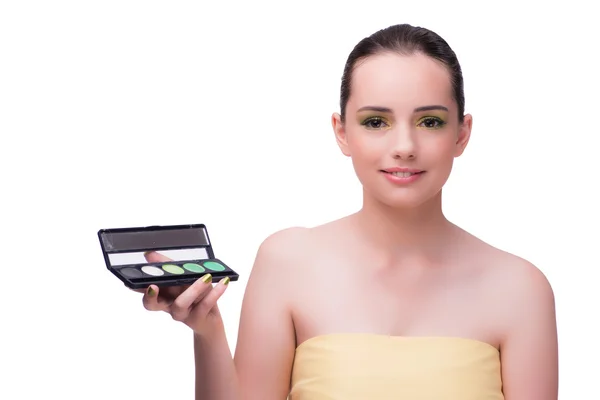 Młoda kobieta podczas sesji makijaż na białym tle — Zdjęcie stockowe