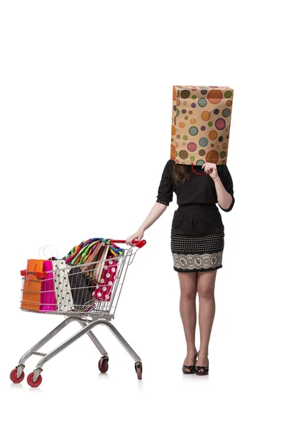 Woman with shopping cart and bags isolated on white — Stock Photo, Image