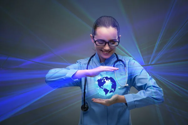 Woman doctor holding earth in globalisation concept — Stock Photo, Image