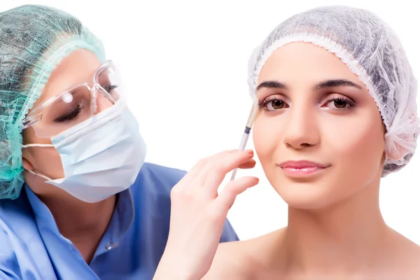 Young woman preparing for plastic surgery isolated on white — Stock Photo, Image