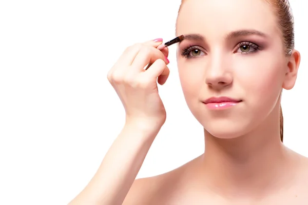 Mooie vrouw tijdens make-up cosmetica sessie — Stockfoto