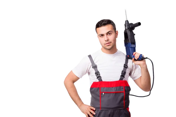 Unga reparatör med drill perforator isolerad på vit — Stockfoto
