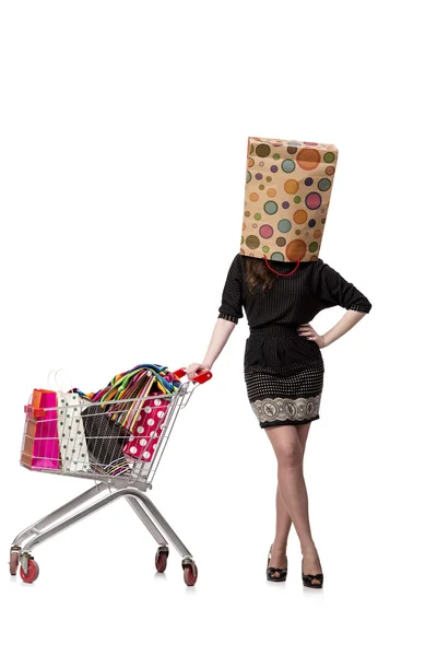 Mujer con carrito de la compra y bolsas aisladas en blanco — Foto de Stock