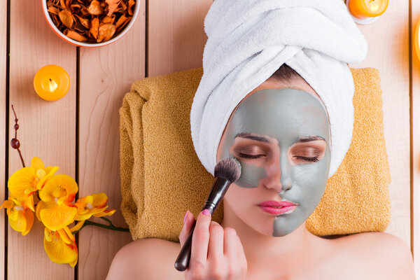 Young woman in spa health concept