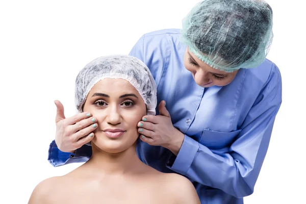 Jovem se preparando para cirurgia plástica isolada em branco — Fotografia de Stock