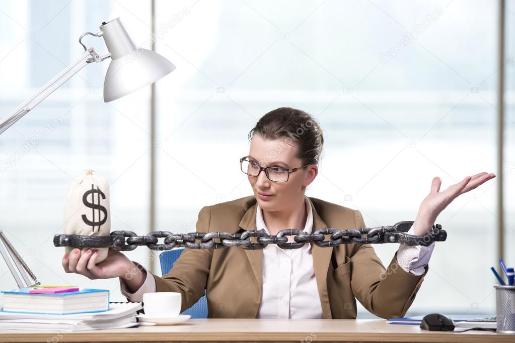 Woman chained to her working desk