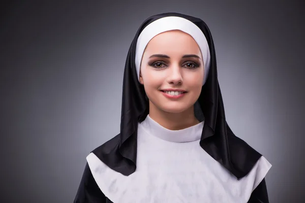 Religious nun in religion concept against dark background — Stock Photo, Image