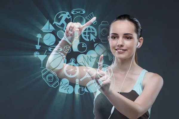 Young girl in sports concept pressing virtual buttons — Stock Photo, Image