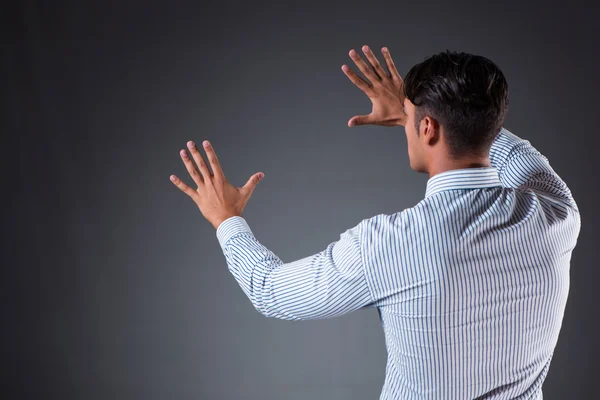 Handsome businessman pressing virtual buttons — Stock Photo, Image