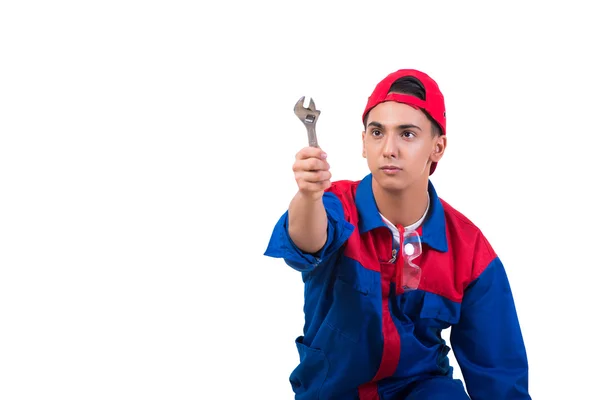 Jovem reparador com chave inglesa isolada em branco — Fotografia de Stock