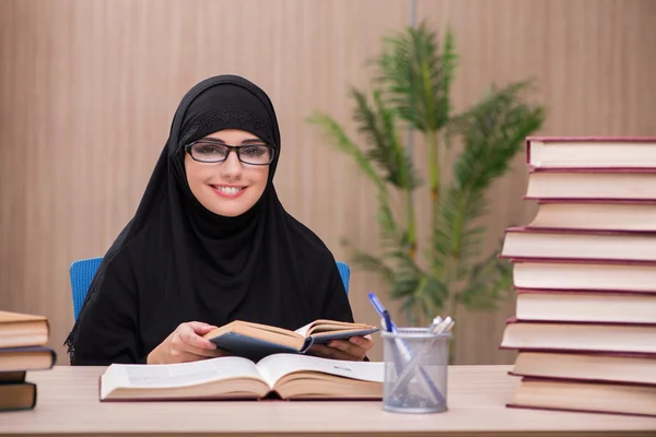 Woman muslim student preparing for exams