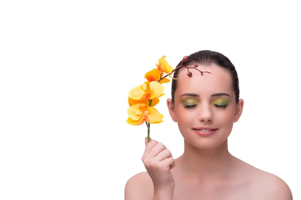 Ung kvinna med orkidé blomma isolerad på vit — Stockfoto