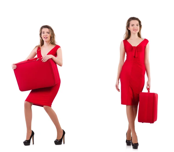 Young woman in red dress with suitcase isolated on white — Stock Photo, Image