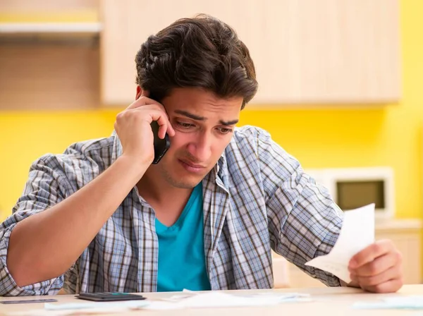 Young man husband in budget planning concept — Stock Photo, Image