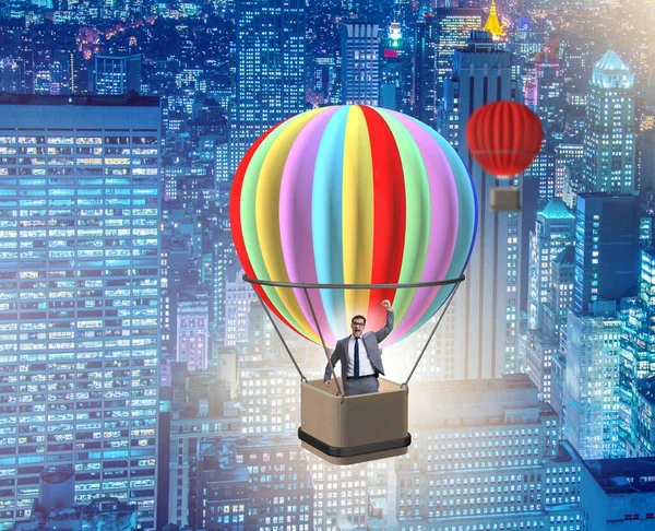 Бизнесмен летит на воздушном шаре в концепции вызова — стоковое фото