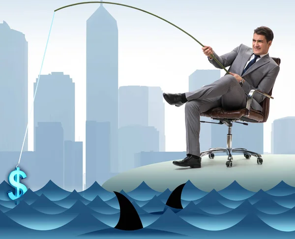 Businessman fishing out dollars from water — Stock Photo, Image